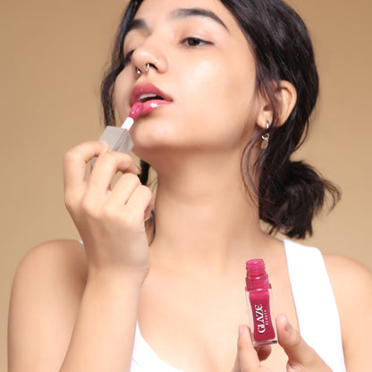 Model Applying Pink Shade Lip Oil